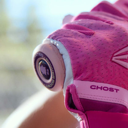 The Easton Power Boost Knob being held by a girl with batting gloves on
