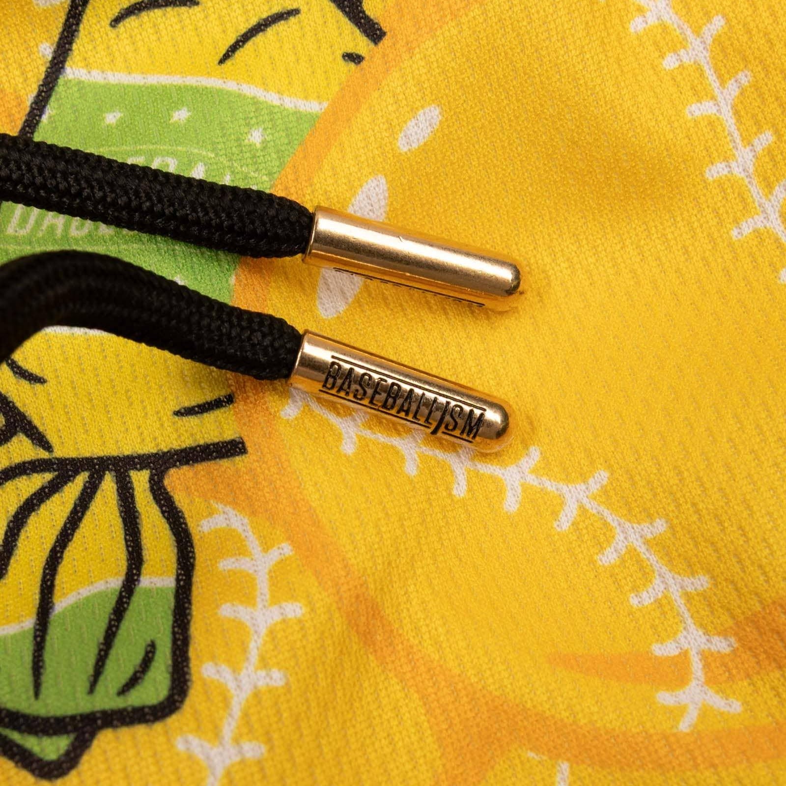 A pair of yellow athletic mesh shorts with a pattern of bubbles and text, and a drawstring waist.