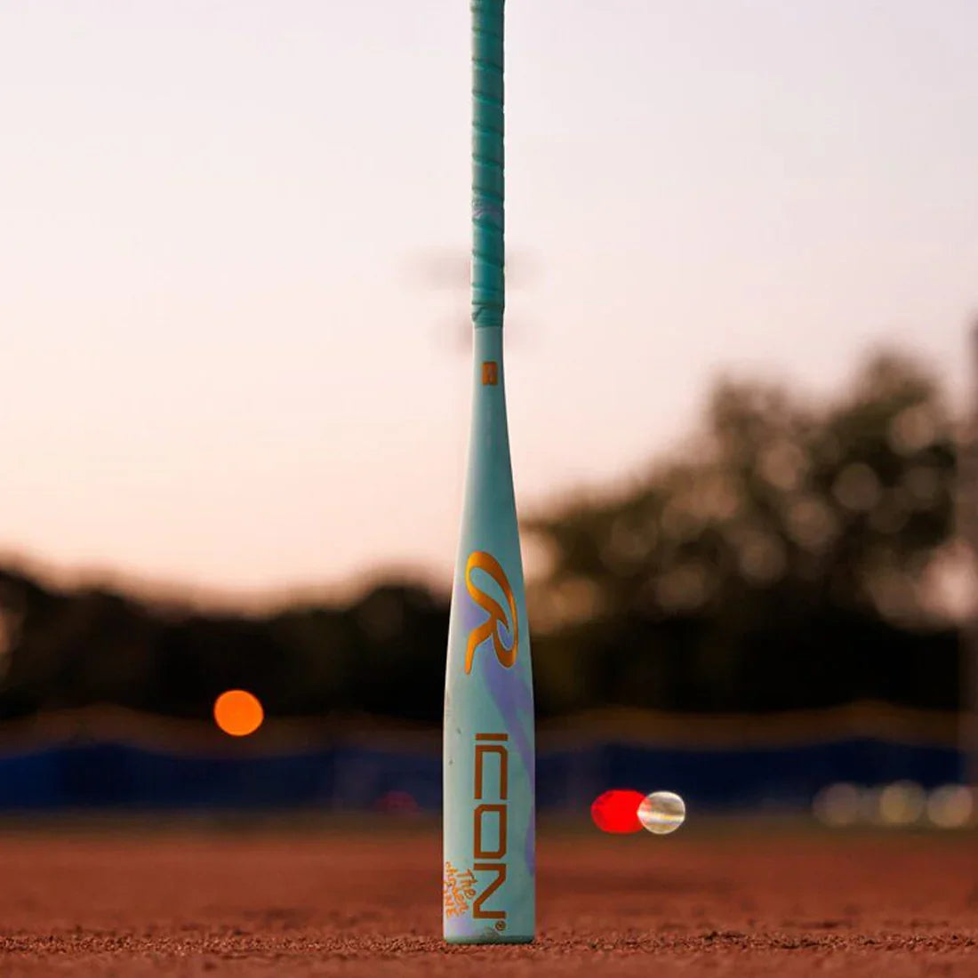 2026 Rawlings Icon The Chosen One -10 USA Baseball Bat: RUS6IONE10 on a baseball field at night
