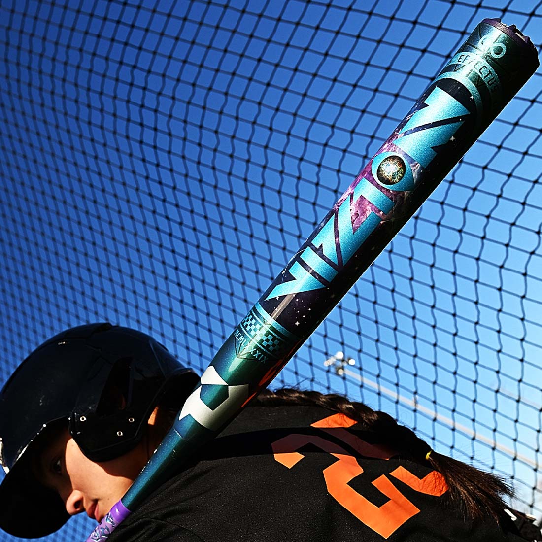 2027 DeMarini Vizion Fastpitch Softball Bat in a batting cage held by a softball player