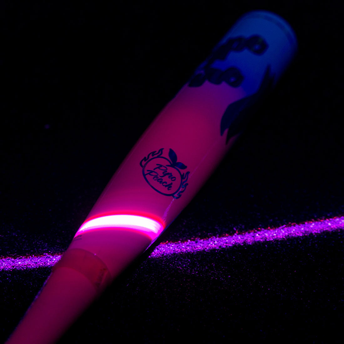 2027 Easton Hype Fire 2 5/8" USA Baseball Bat in neon lighting on black turf