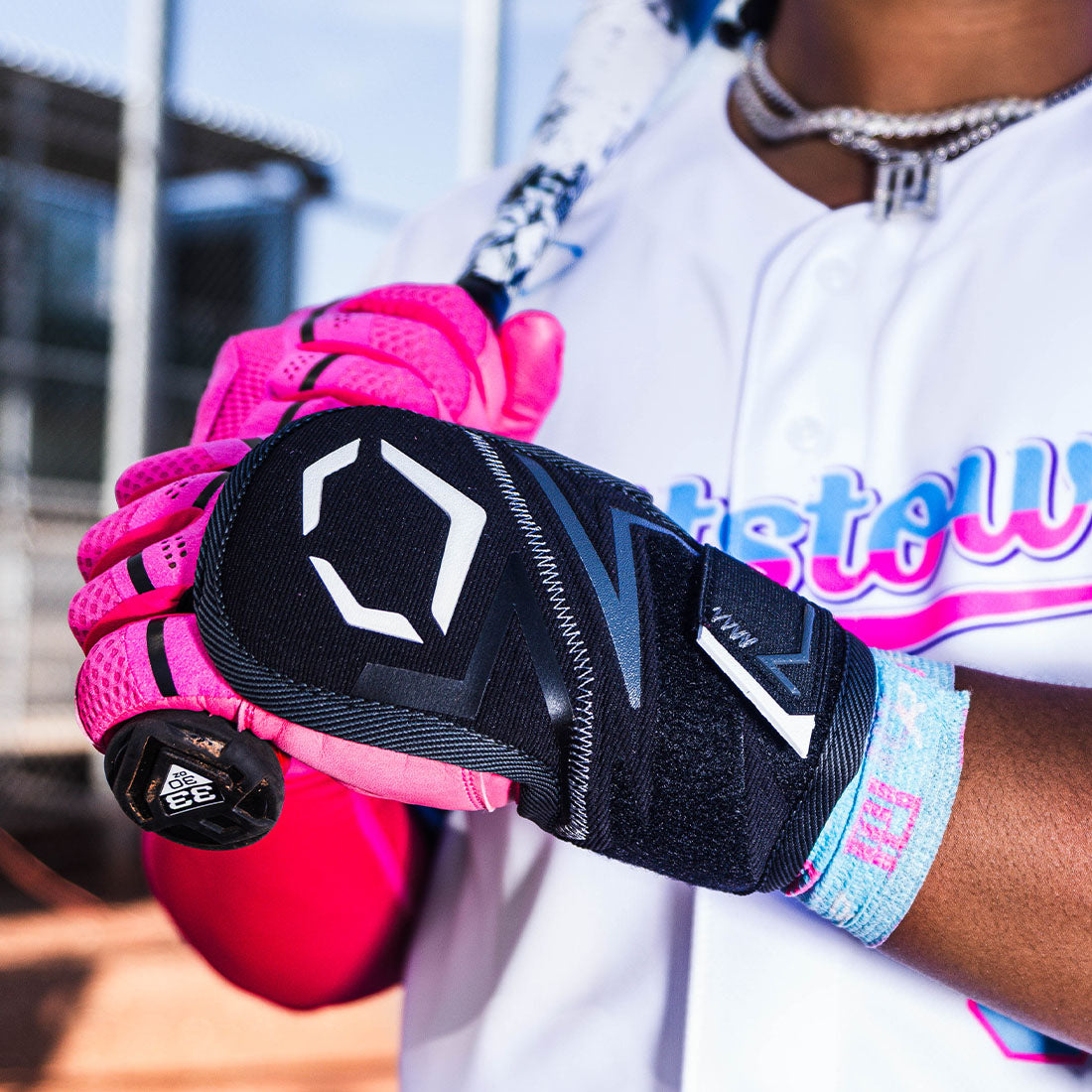 A baseball player at a baseball stadium wearing a Black Evoshield Pro-Srz 3.0 Batter's Hand Guard from Headbanger Sports