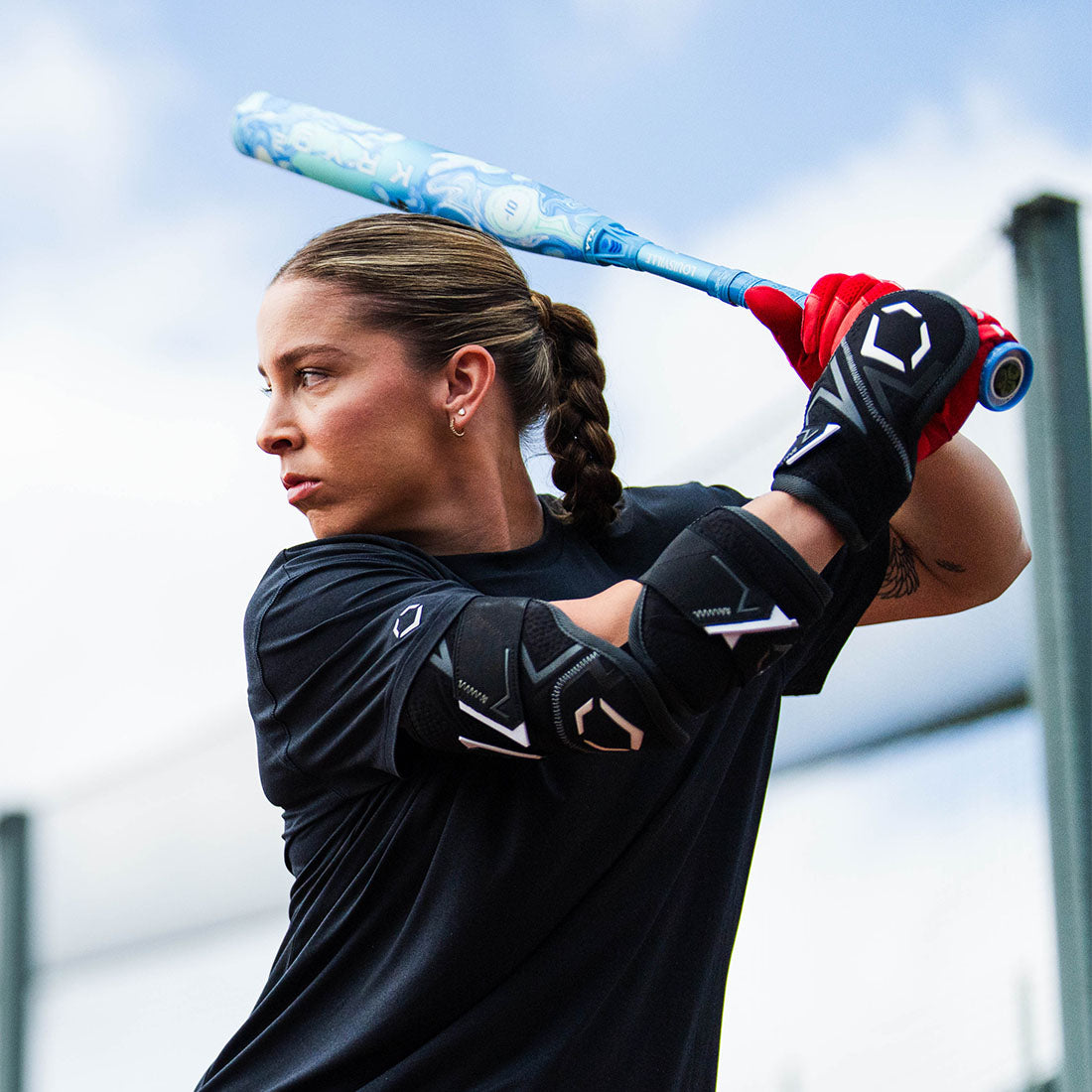 Black Evoshield Pro-SRZ 3.0 Batter's Two-Piece Elbow Guard worn by a college softball player