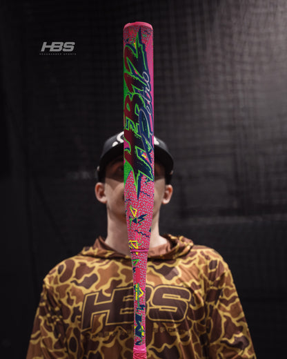 Softball player holding the 2026 Miken HB12 Retro 12.5" End Loaded USA / ASA Slowpitch Softball Bat in the batting cages at Headbanger Sports.