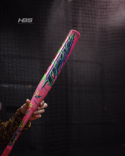Softball player holding the 2026 Miken HB12 Retro 12.5" End Loaded USA / ASA Slowpitch Softball Bat in the batting cages at Headbanger Sports.