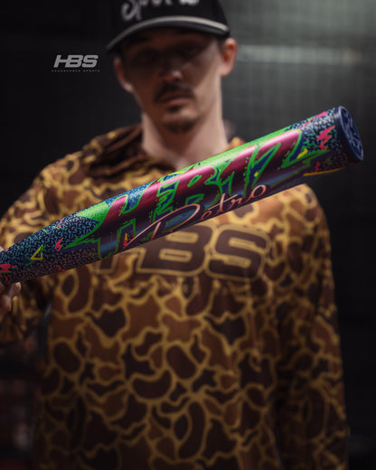 Softball player holding the 2026 Miken HB12 Retro 12.5" End Loaded USSSA Slowpitch Softball Bat in the batting cages at Headbanger Sports.