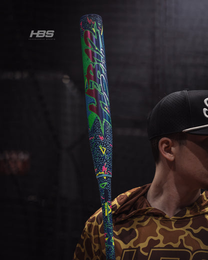 Softball player holding the 2026 Miken HB12 Retro 12.5" End Loaded USSSA Slowpitch Softball Bat in the batting cages at Headbanger Sports.