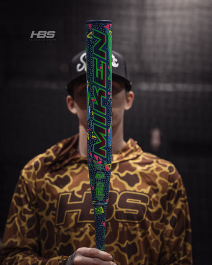 Softball player holding the 2026 Miken HB12 Retro 12.5" End Loaded USSSA Slowpitch Softball Bat in the batting cages at Headbanger Sports.