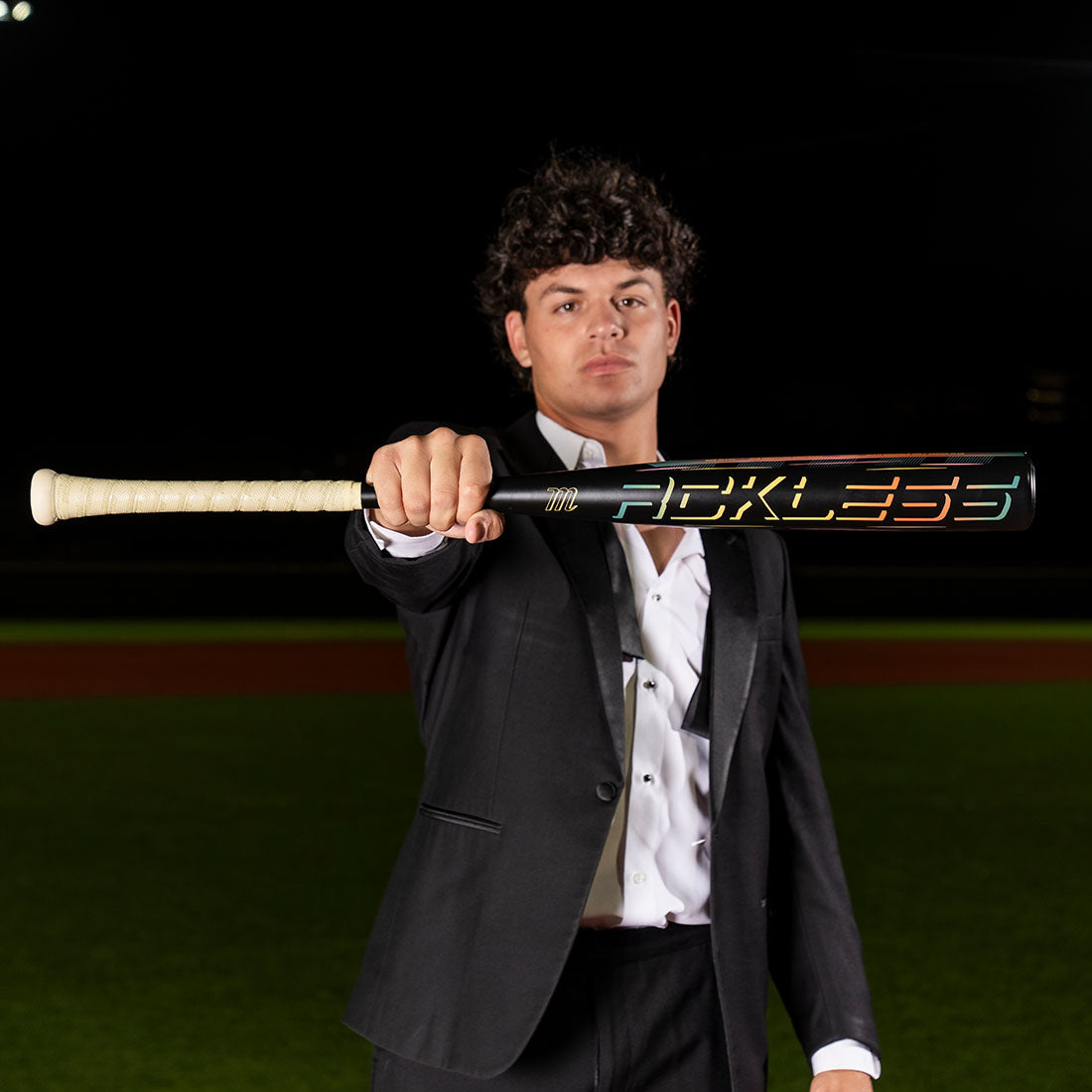 Marucci RCKLESS Gen 2 Alloy BBCOR baseball bat balanced one-piece alloy held by a player in dress attire