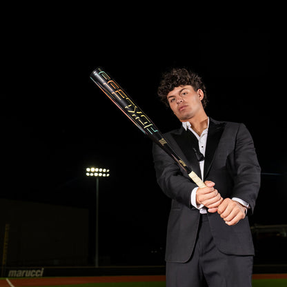 Marucci RCKLESS Gen 2 Alloy BBCOR baseball bat balanced one-piece alloy on a dark baseball field.