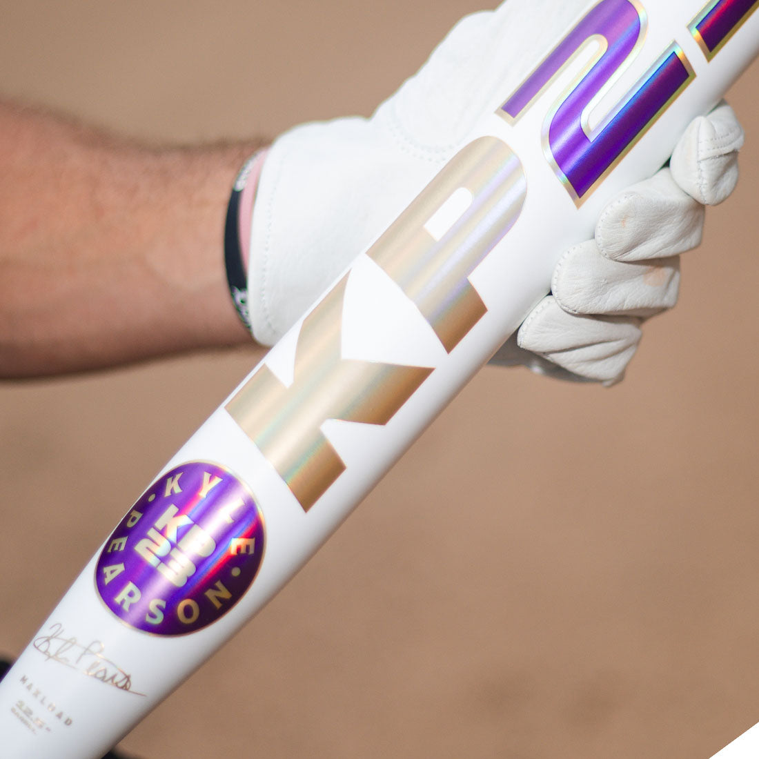 2026 Miken KP23 Kyle Pearson 12.5" End Loaded USSSA Slowpitch Softball Bat being held on a dirt infield