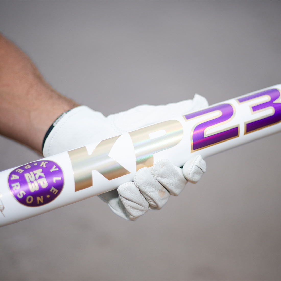 2026 Miken KP23 Kyle Pearson 14" 1PC USSSA Slowpitch Softball Bat held by Kyle Pearson with white batting gloves on.