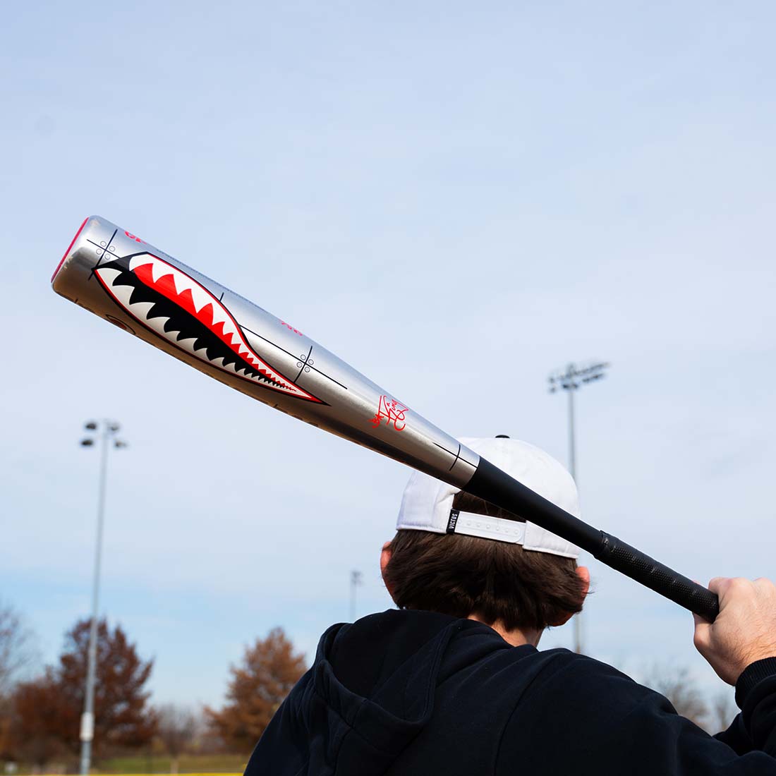 Victus VIBE Warhawk (-3) BBCOR Baseball Bat in a hitters hand. Military themed baseball bat
