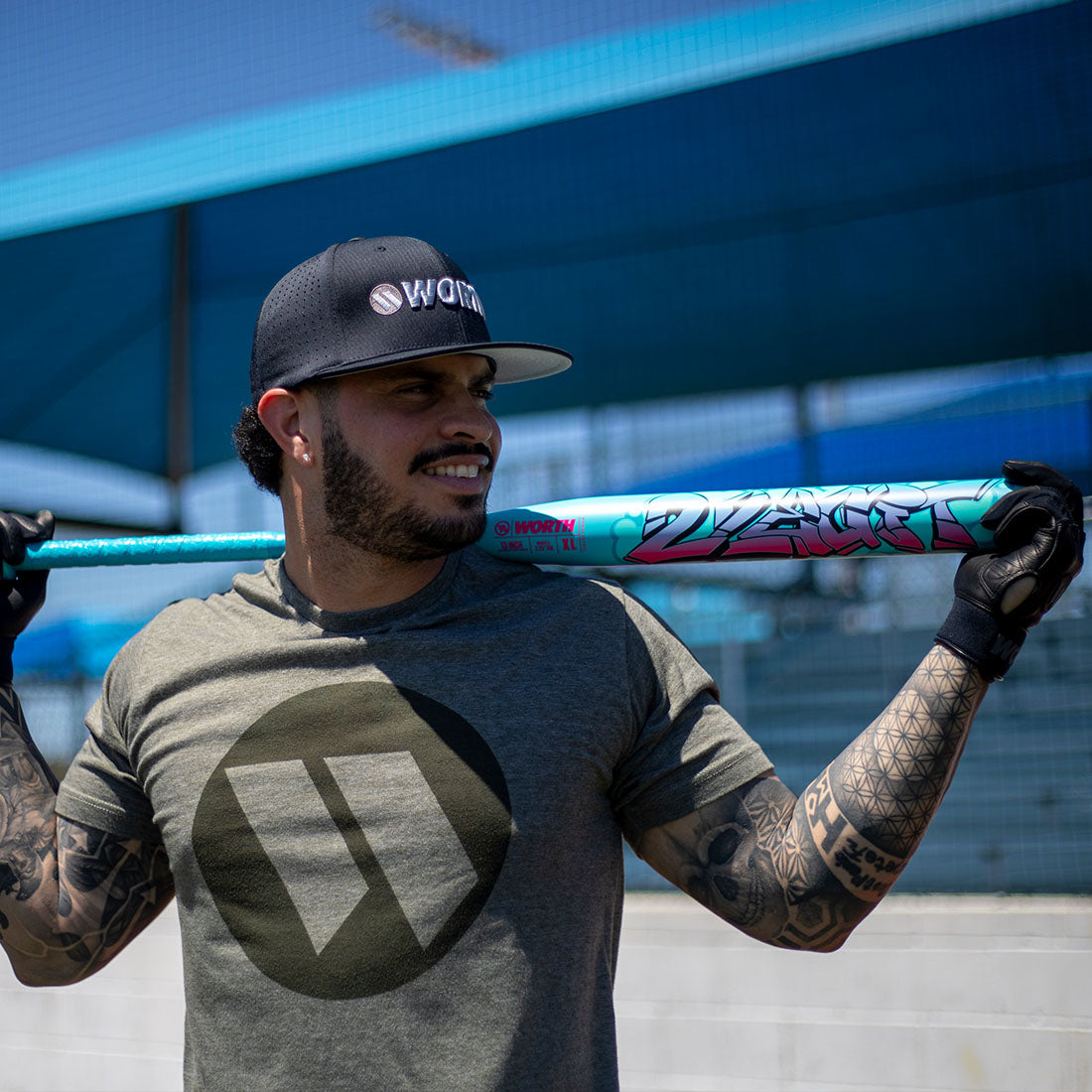 Slowpitch player holding the 2026 Worth 2 Legit 13" 1PC XL End Loaded USSSA Slowpitch Softball Bat at Space Coast Fields