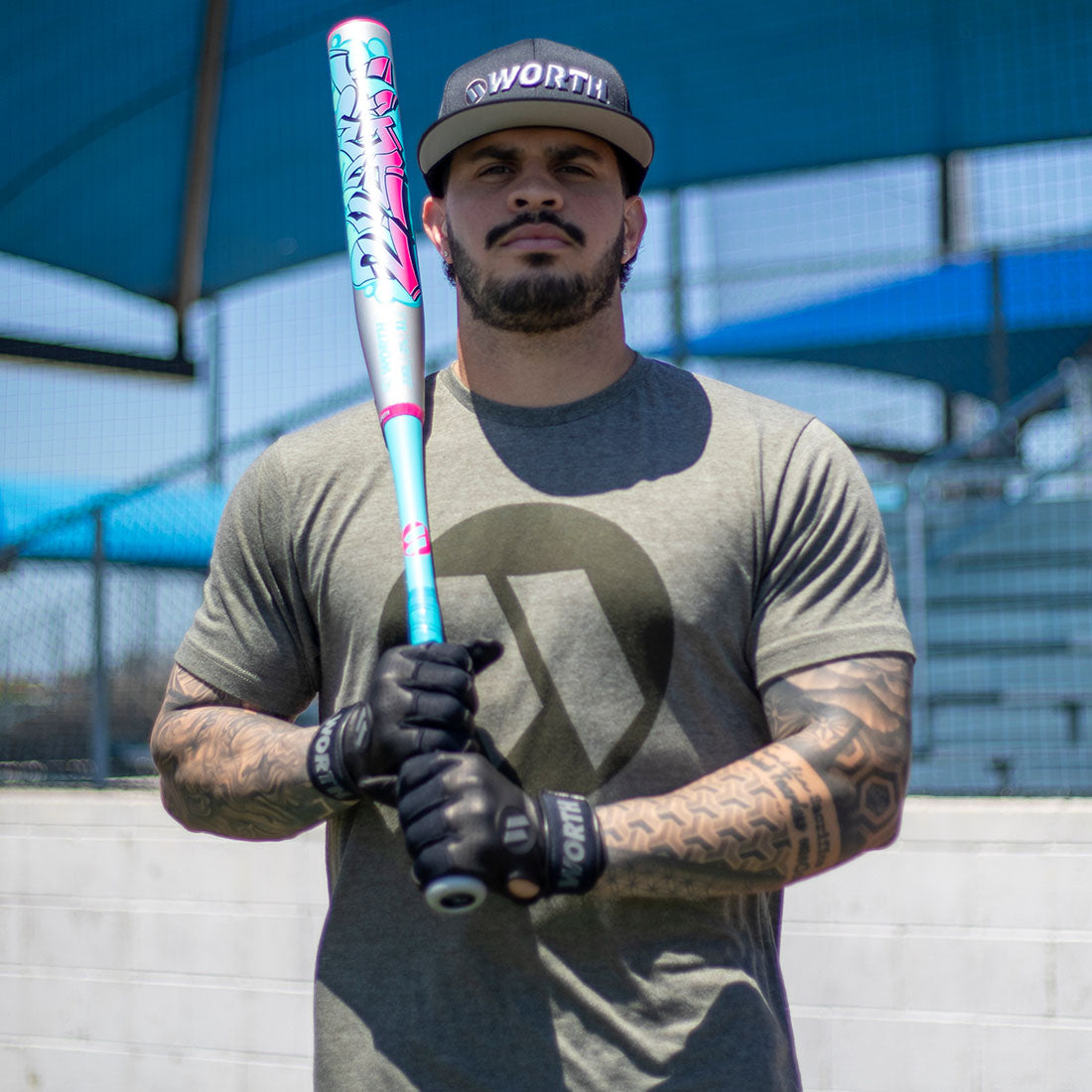 A slowpitch softball players holding the new Worth 2 Legit XL USA slowpitch bat 