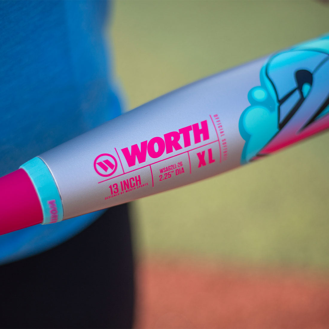 A slowpitch softball players holding the new Worth 2 Legit XL USA slowpitch bat 